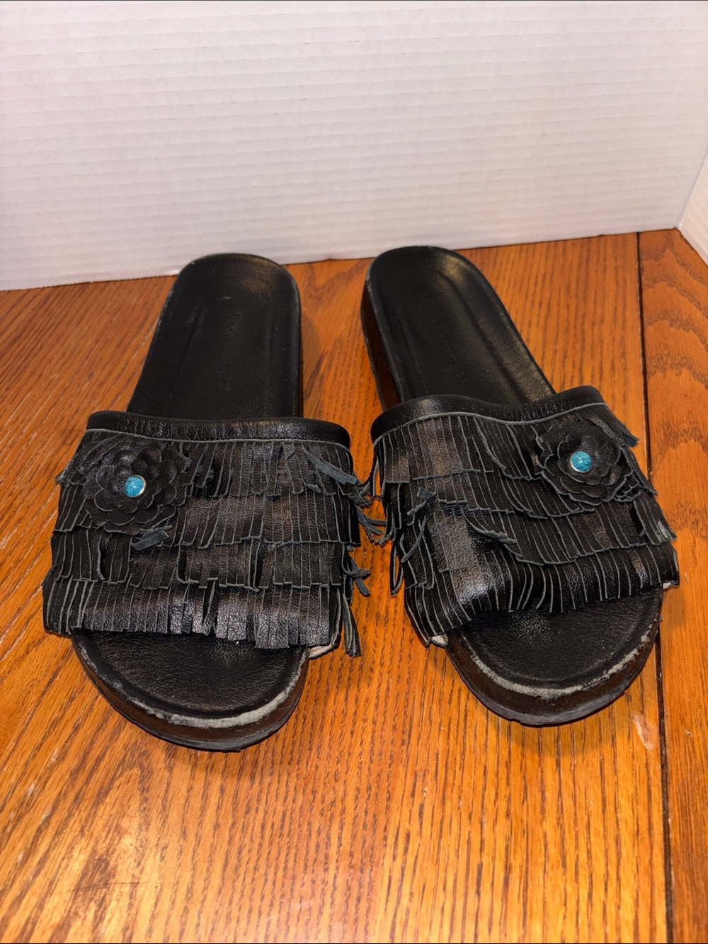 Women's Black Fringe Slide Sandals with Turquoise Flower Accent